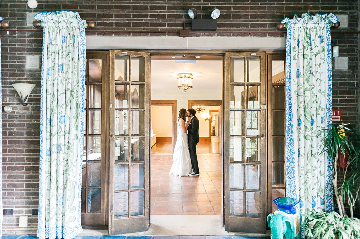 Bride and groom kissing at Cheney Mansion