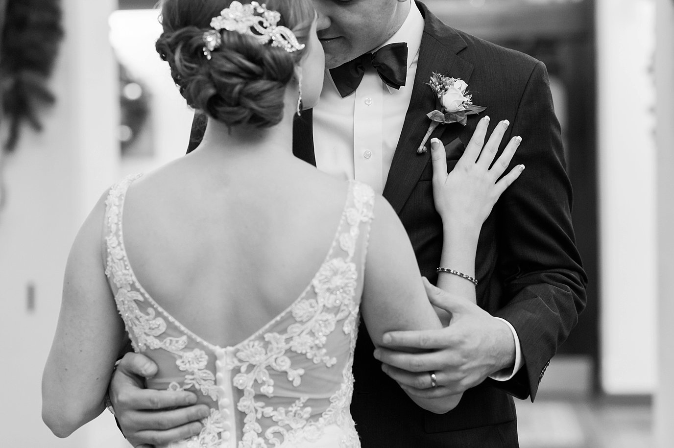 close up of bride and groom embracing