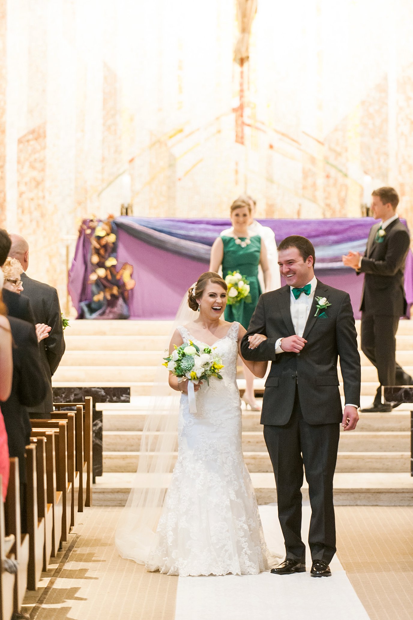 recessional bride and groom smiling
