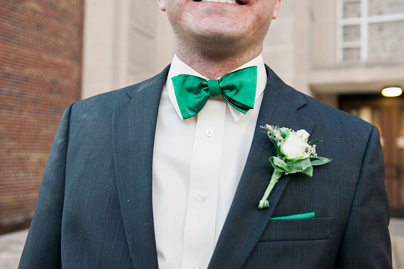 close-up of groom's green bowtie